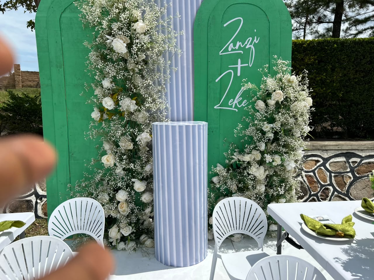 Dream Events ceremony setup with layered floral decor