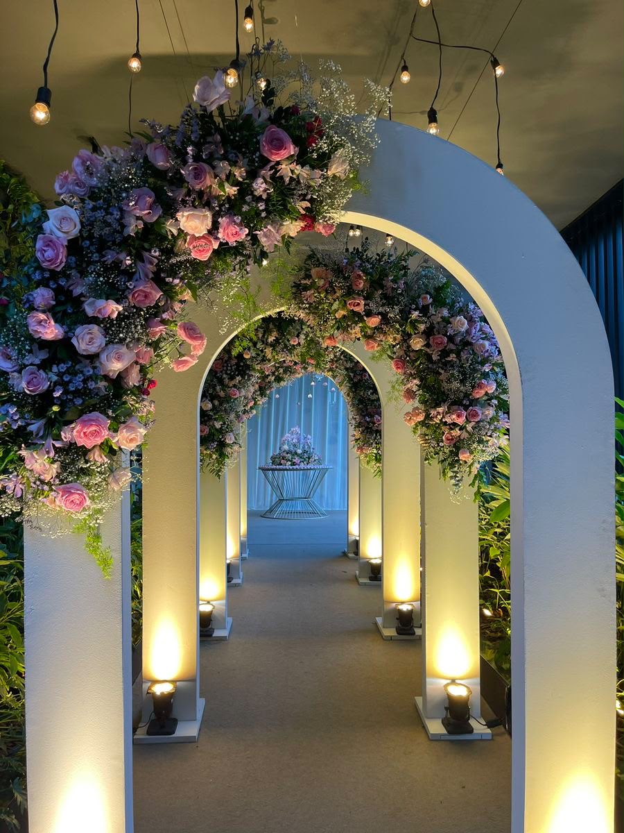 Dream Events ceremony setup with layered floral decor